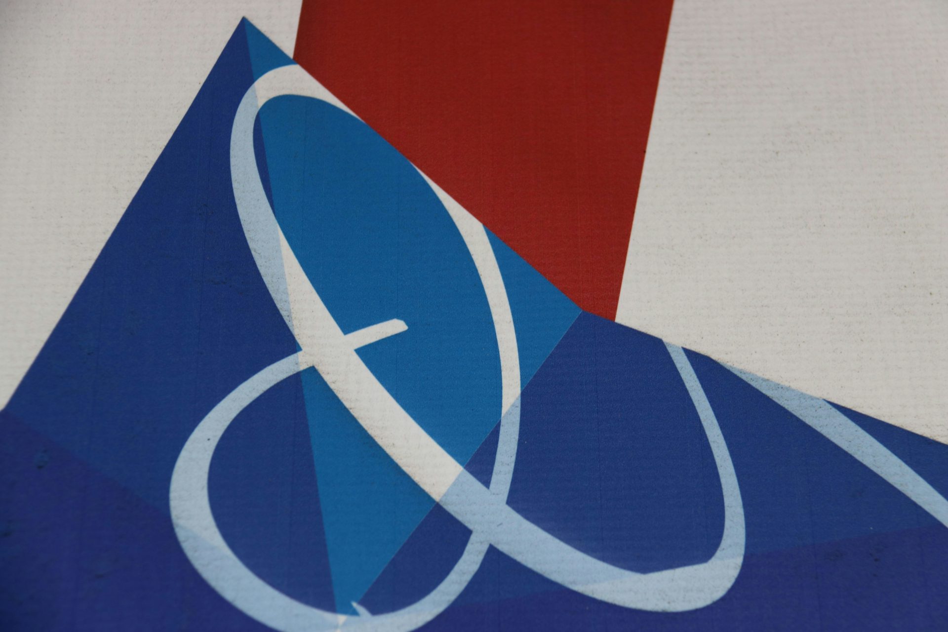 a close up of a logo on a wall